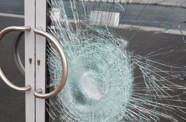 Broken Door in laminated Harrow laminated Safety Glass